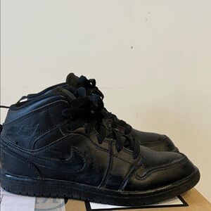 Jordan’s kids size 2 Black High-Top Sneakers.